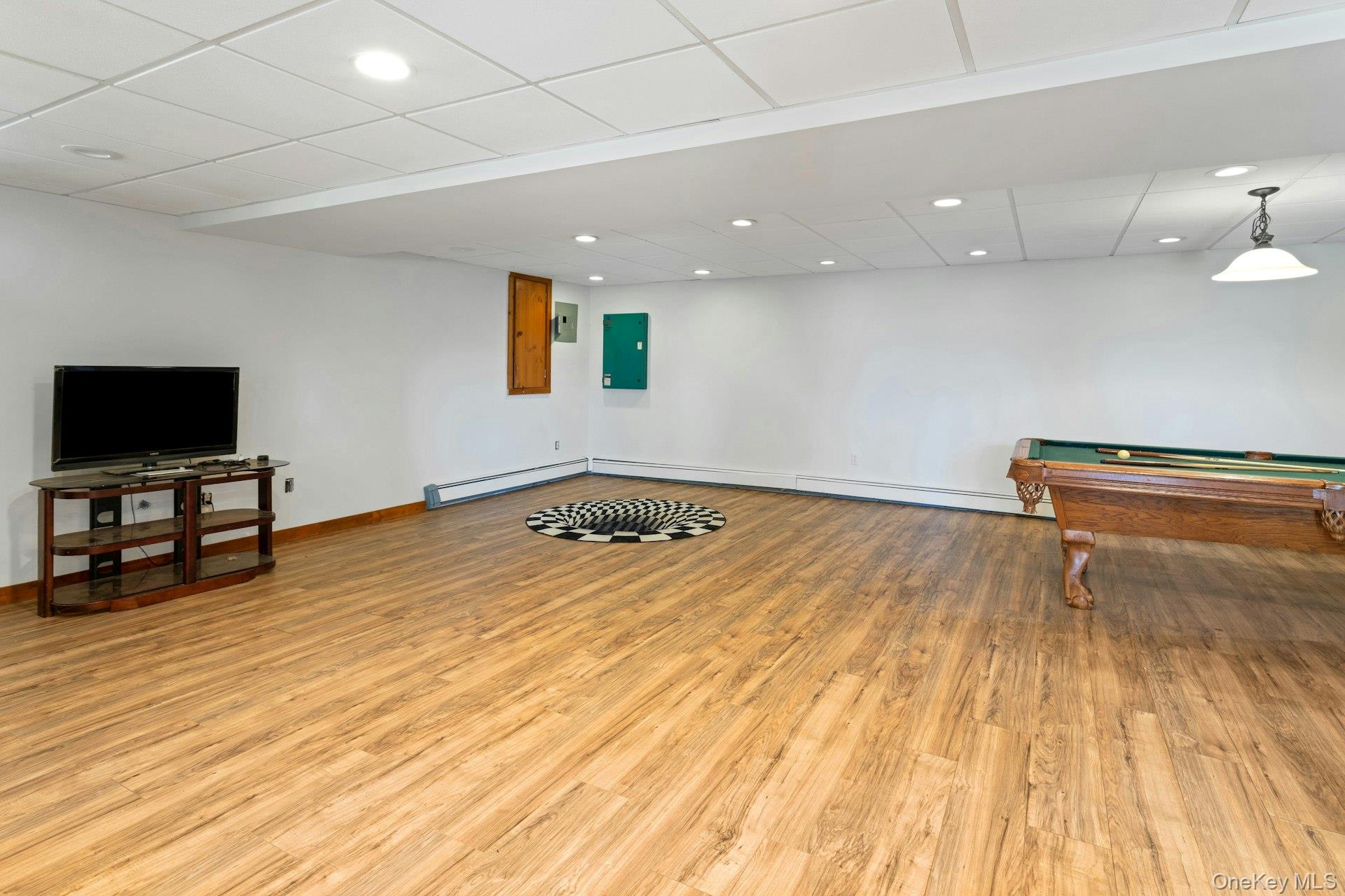 354 Sunset Hill Road East Fishkill, NY 12524 - Photo 23 of 31 a view of room with wooden floor and flat screen tv