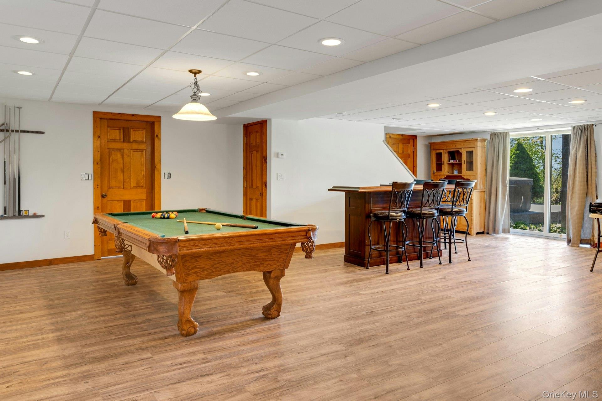 354 Sunset Hill Road East Fishkill, NY 12524 - Photo 25 of 31 a living room with furniture pool table and a wooden floor