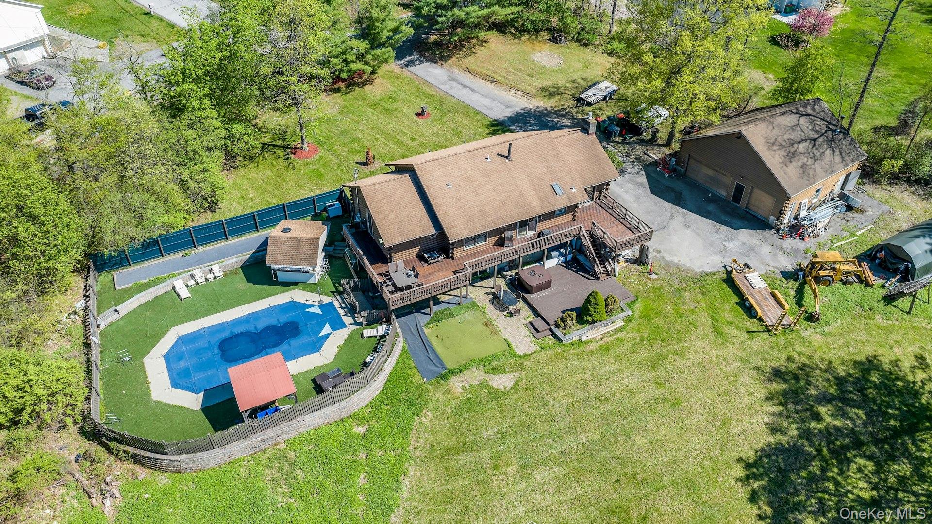 354 Sunset Hill Road East Fishkill, NY 12524 - Photo 28 of 31 an aerial view of a house with swimming pool and large trees
