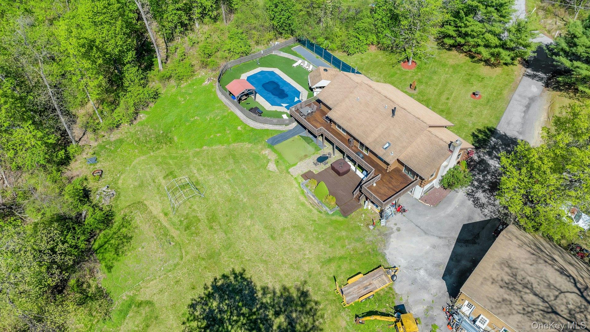 354 Sunset Hill Road East Fishkill, NY 12524 - Photo 29 of 31 an aerial view of a house with a yard and large trees