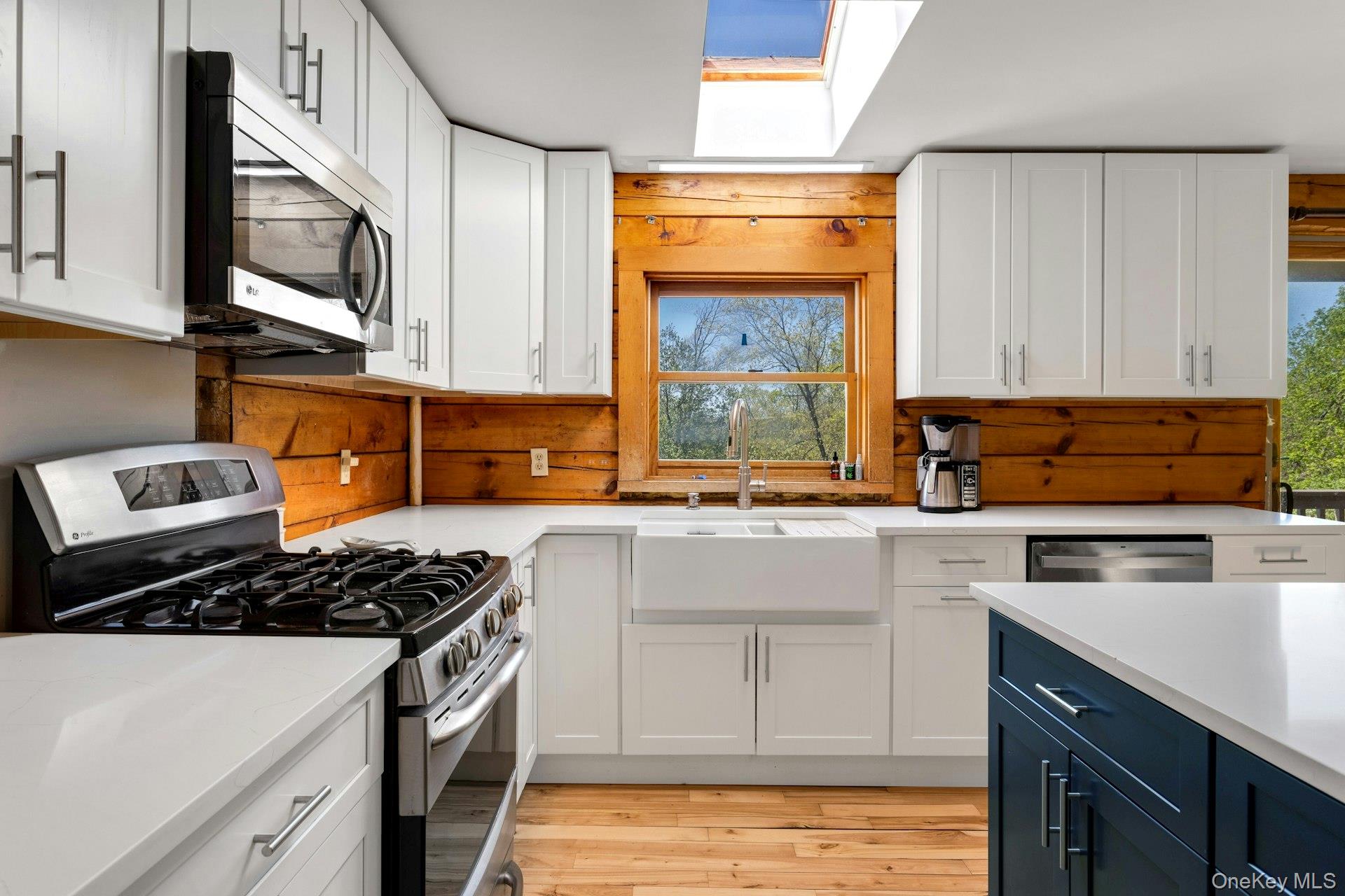 354 Sunset Hill Road East Fishkill, NY 12524 - Photo 9 of 31 a kitchen with stainless steel appliances granite countertop a stove a sink and a microwave