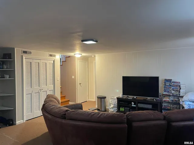 a view of an empty room and fire place