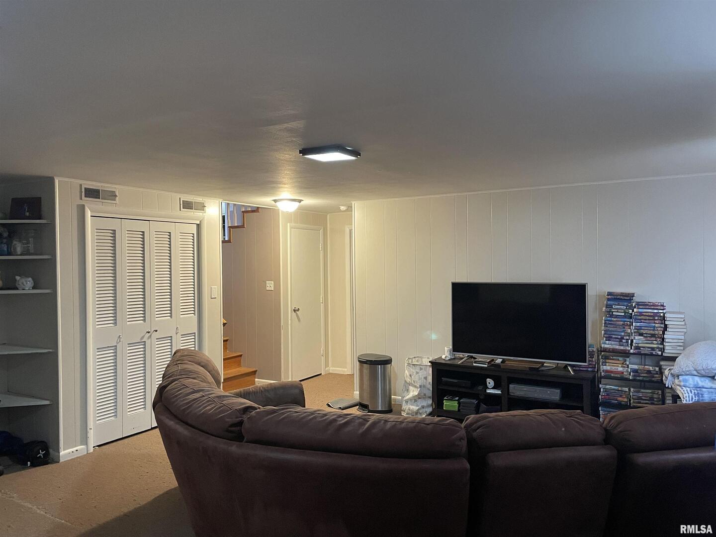 217 Apple Lane Anna, IL 62906 - Photo 18 of 39 a living room with furniture and a flat screen tv