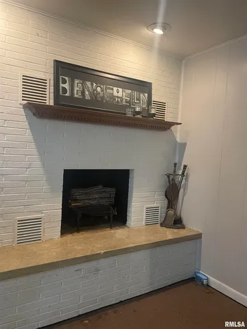 a view of white cabinets with a wooden floor