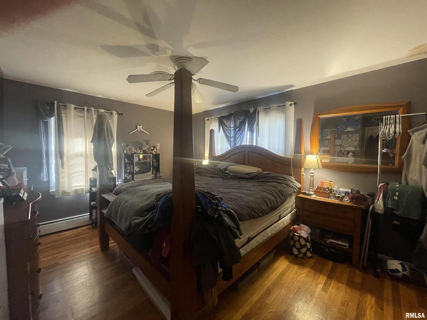 217 Apple Lane Anna, IL 62906 - Photo 32 of 39 a spacious bedroom with a bed and wooden floor