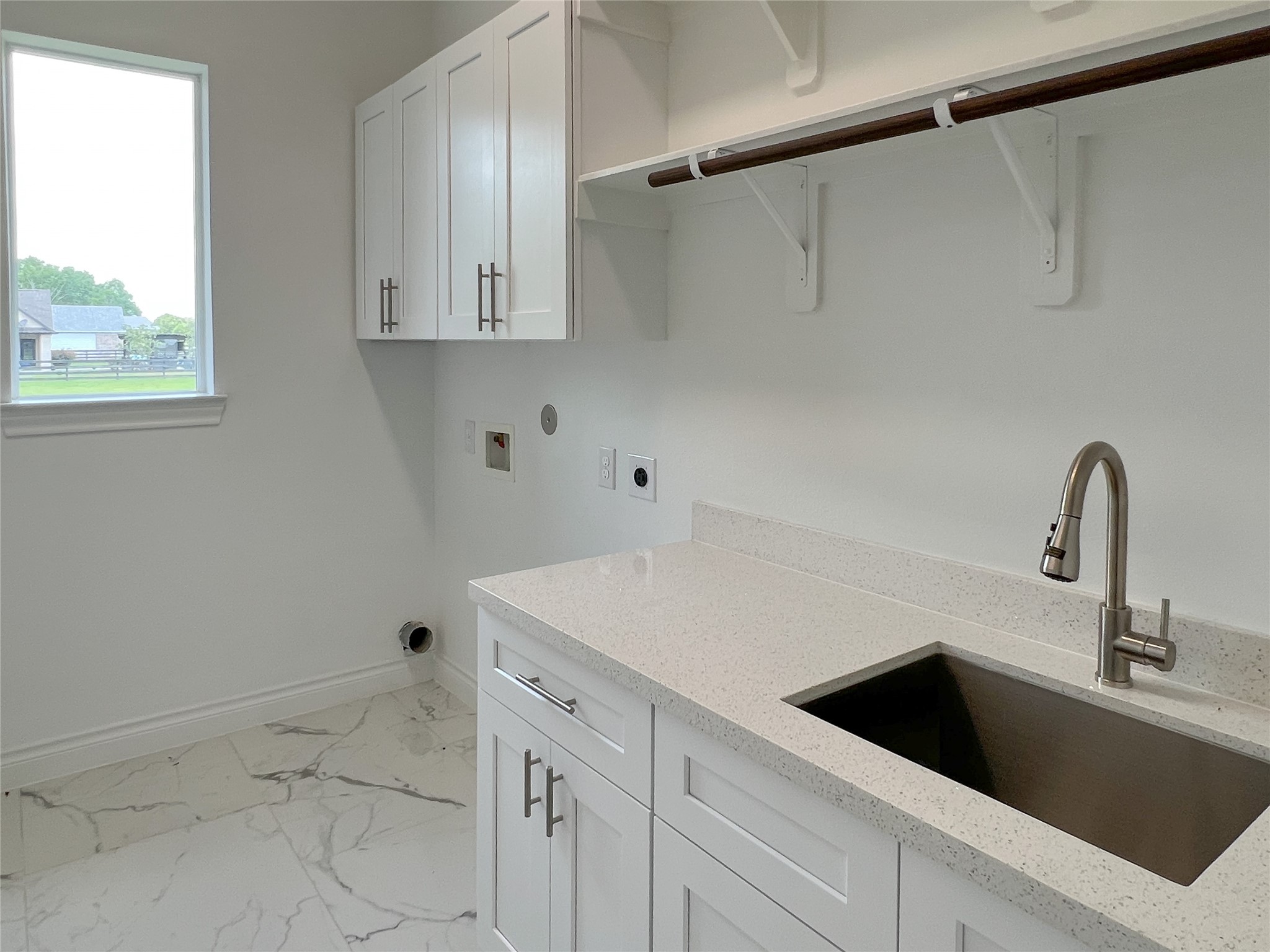 126 Lakeland Circle Rosharon, TX 77583 - Photo 25 of 49 a view of a sink a refrigerator and cabinets