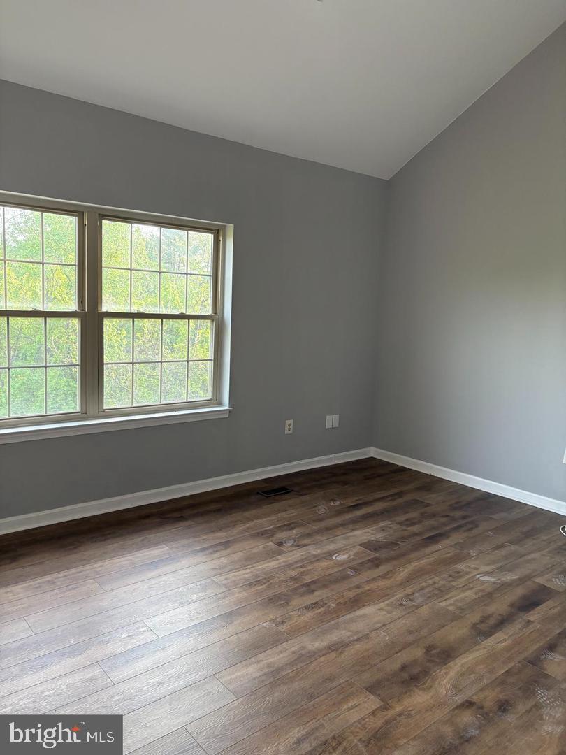 178 English Run Circle Sparks Glencoe, MD 21152 - Photo 13 of 24 wooden floor in an empty room with a window