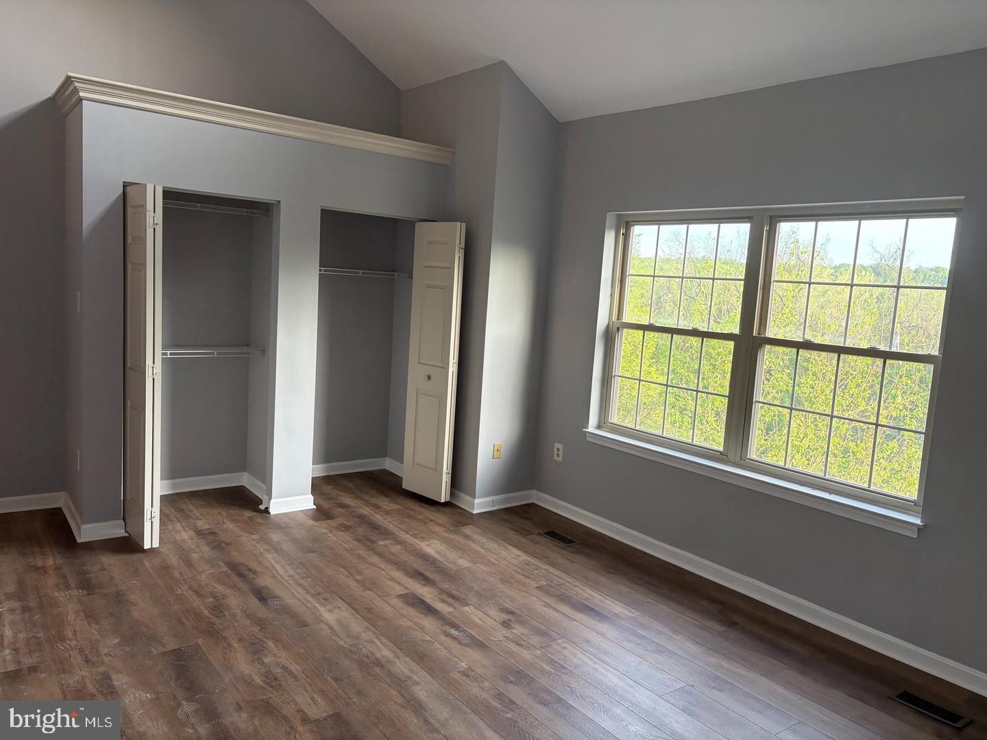 178 English Run Circle Sparks Glencoe, MD 21152 - Photo 6 of 24 an empty room with wooden floor and windows