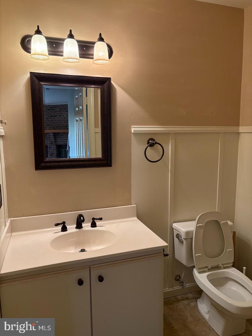 178 English Run Circle Sparks Glencoe, MD 21152 - Photo 8 of 24 a bathroom with a sink mirror vanity and toilet