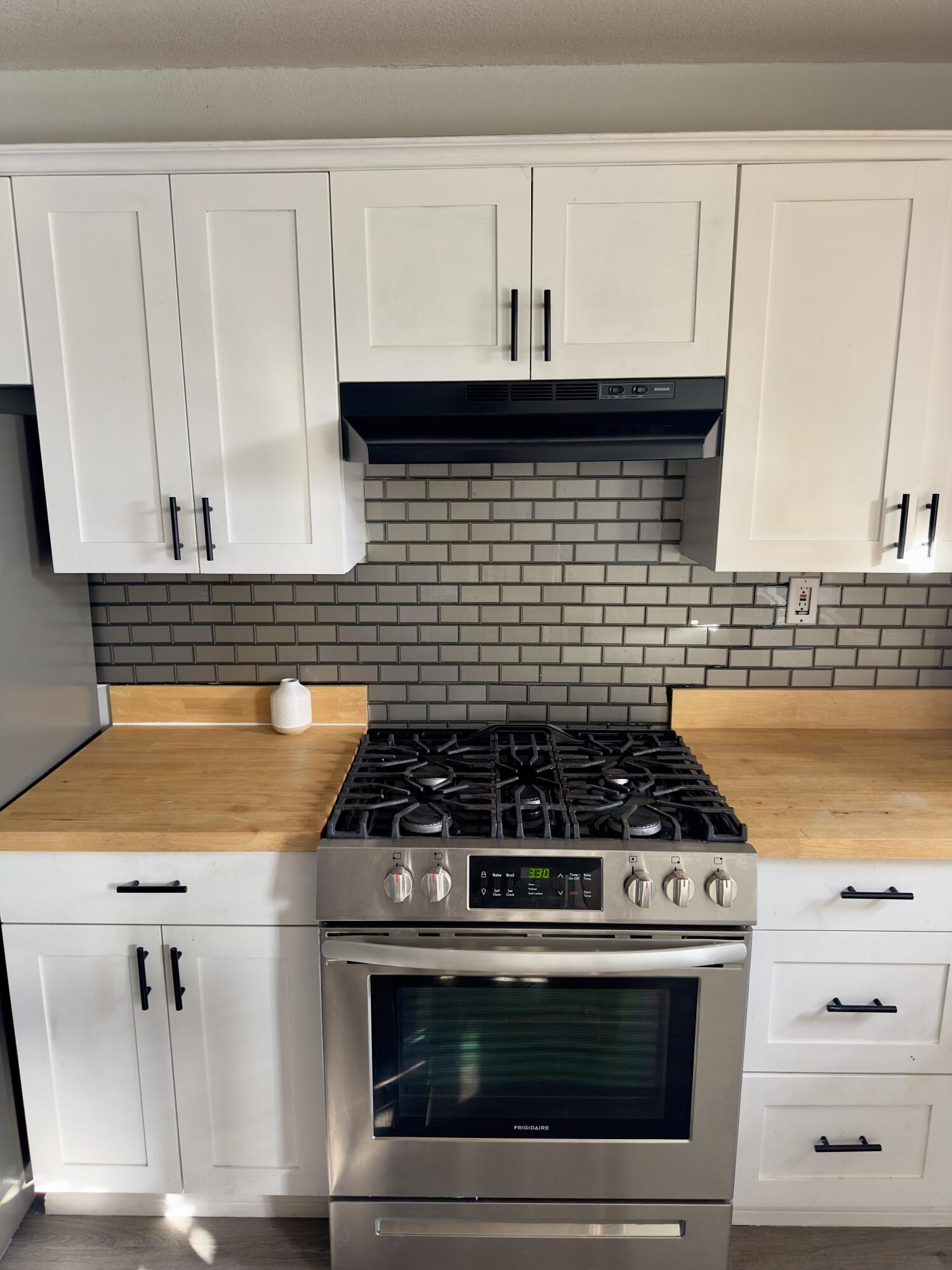 4807 39th Street Lubbock, TX 79414 - Photo 14 of 29 a stove top oven sitting inside of a kitchen