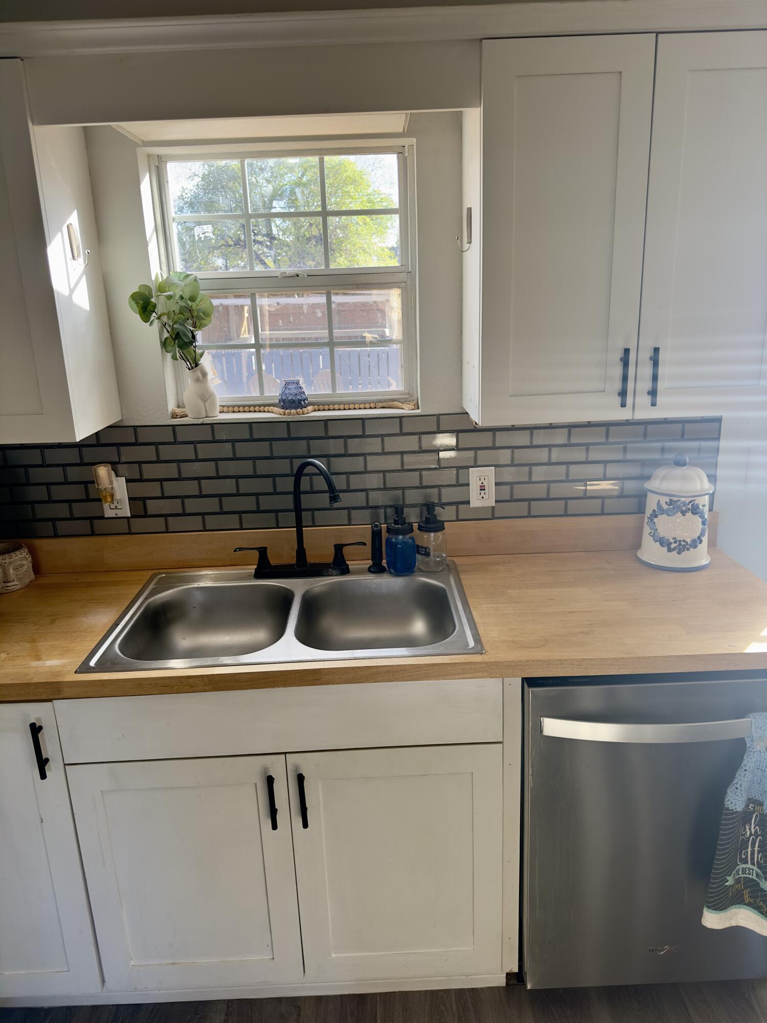 4807 39th Street Lubbock, TX 79414 - Photo 15 of 29 a kitchen with a sink and a window