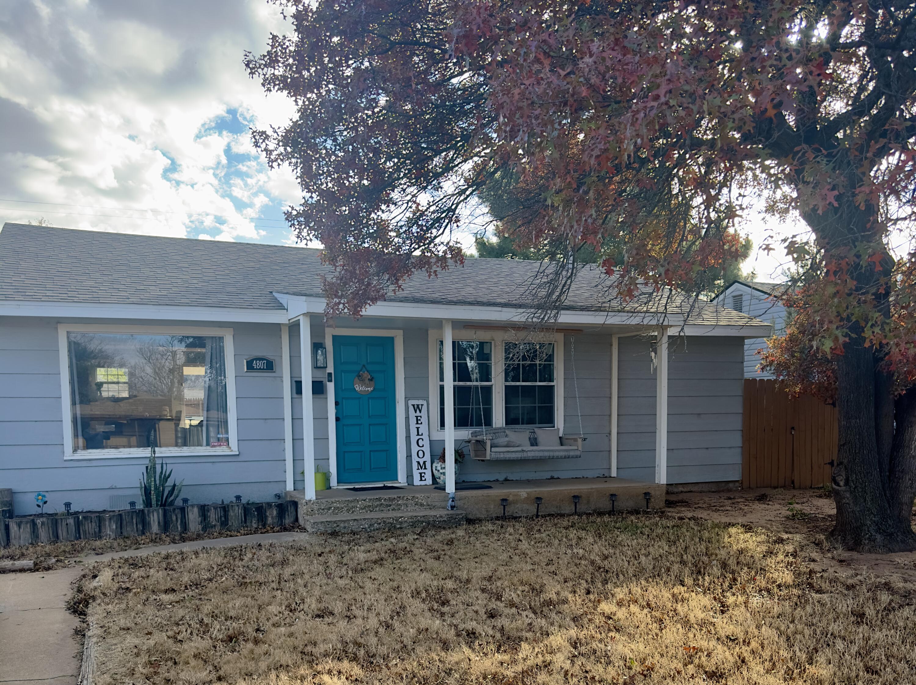 4807 39th Street Lubbock, TX 79414 - Photo 2 of 29 a front view of a house with garden