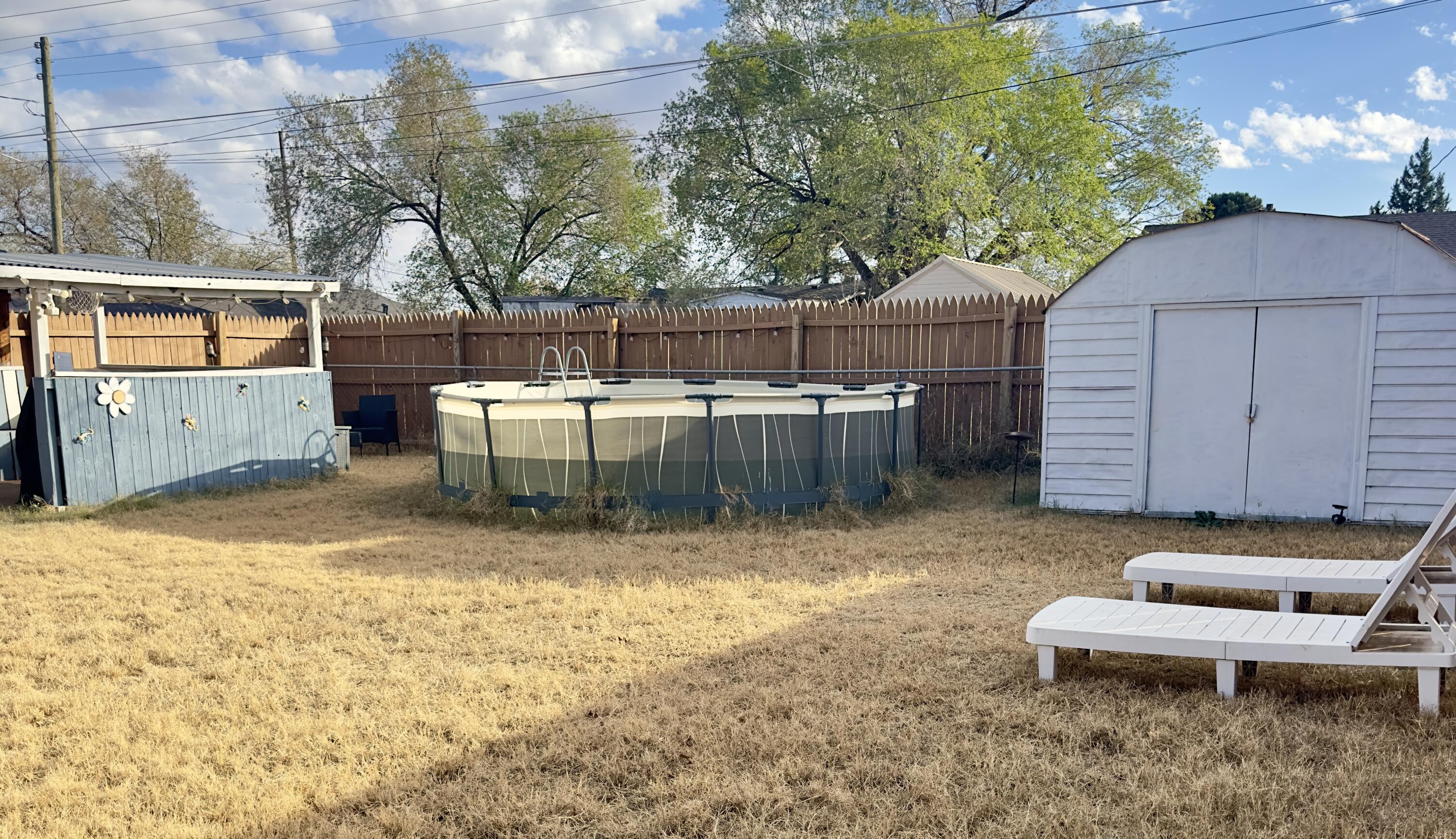 4807 39th Street Lubbock, TX 79414 - Photo 27 of 29 a view of a backyard with sitting area