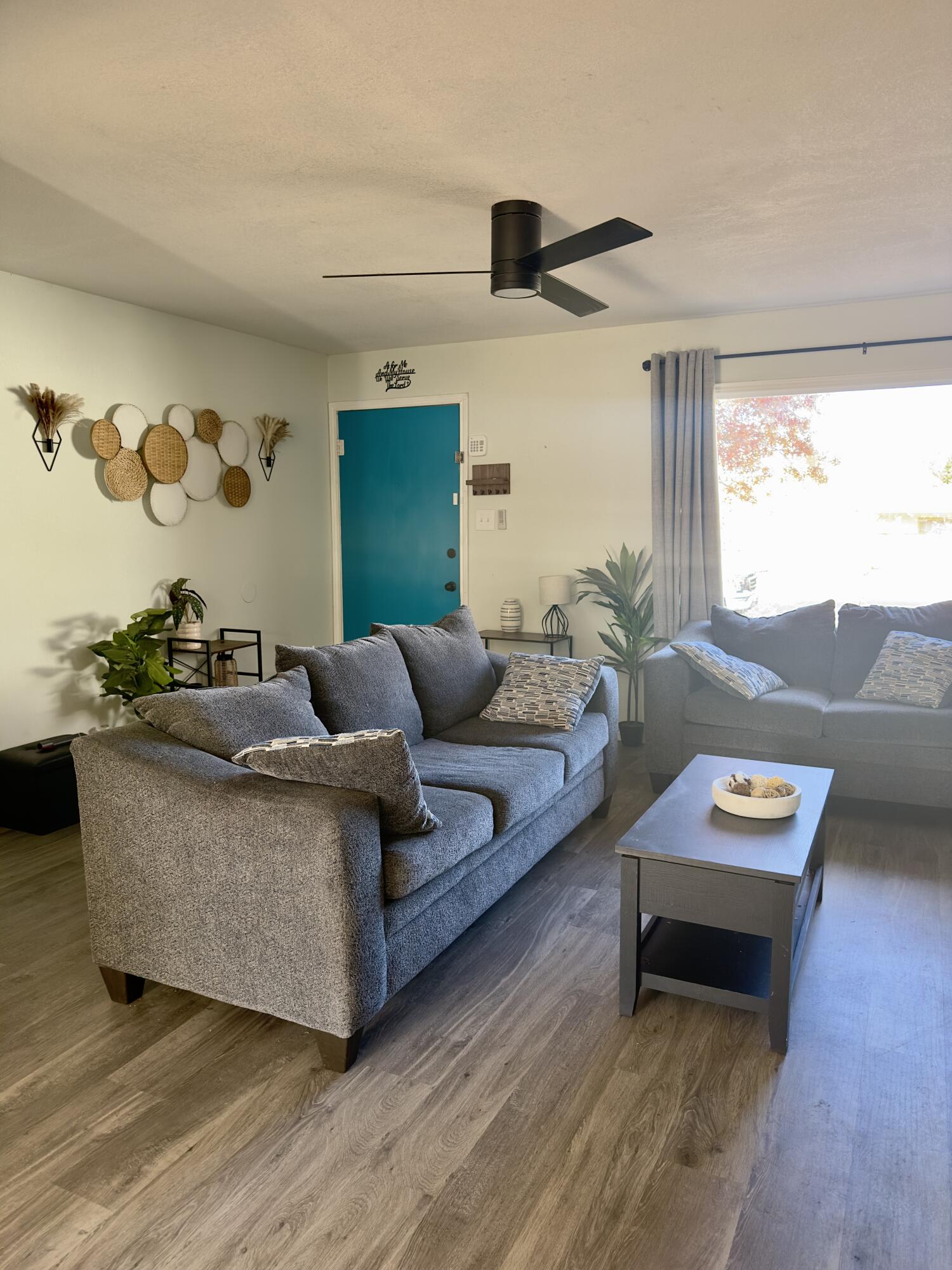 4807 39th Street Lubbock, TX 79414 - Photo 4 of 29 a living room with furniture and a flat screen tv