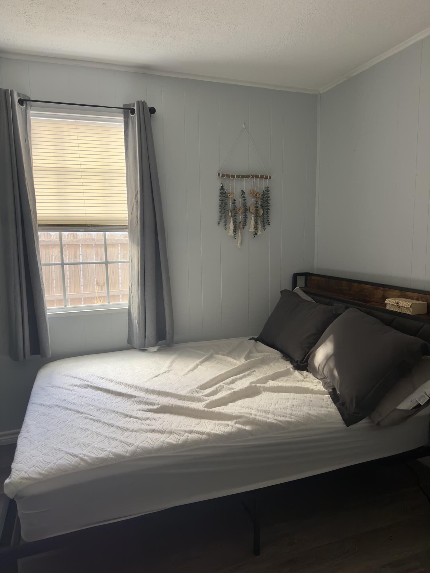 4807 39th Street Lubbock, TX 79414 - Photo 8 of 29 a bedroom with a bed and window