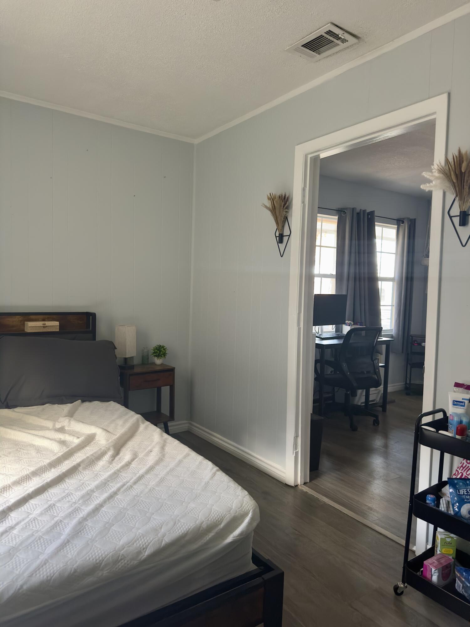 4807 39th Street Lubbock, TX 79414 - Photo 10 of 29 a bedroom with a bed and a view of bedroom