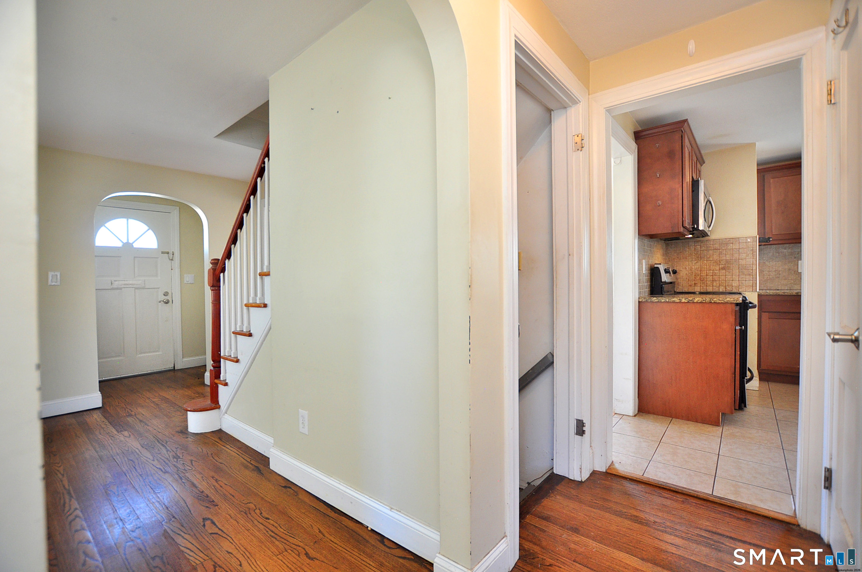 103 West Center Street Manchester, CT 06040 - Photo 21 of 29 a view of a hallway with wooden floor and a bathroom
