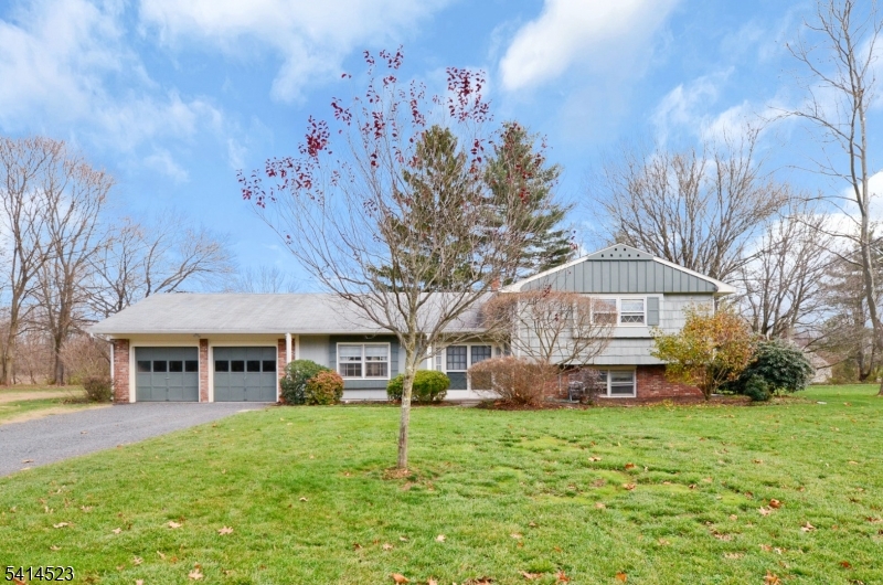 19 Jamestown Road Belle Mead, NJ 08502 - Photo 1 of 22 a front view of a house with a garden