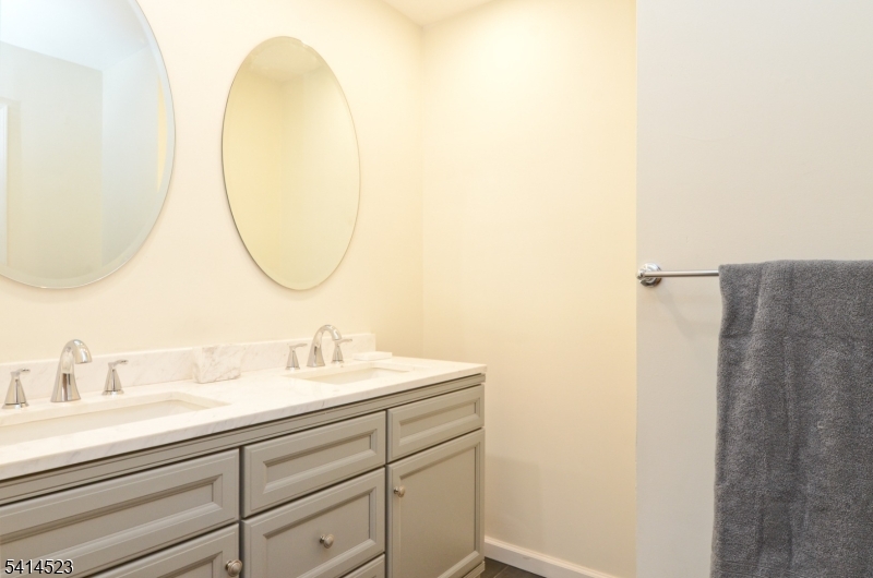 19 Jamestown Road Belle Mead, NJ 08502 - Photo 14 of 22 a bathroom with a sink and a mirror