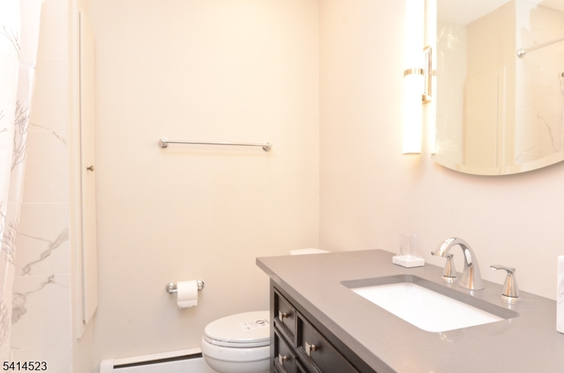 19 Jamestown Road Belle Mead, NJ 08502 - Photo 18 of 22 a bathroom with a sink toilet and mirror