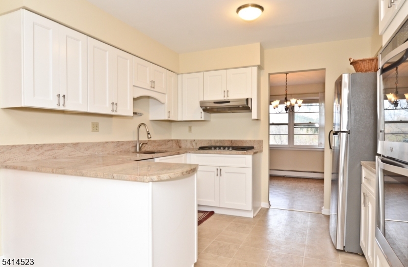 19 Jamestown Road Belle Mead, NJ 08502 - Photo 6 of 22 a kitchen with stainless steel appliances granite countertop a refrigerator sink and white cabinets