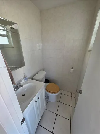 a kitchen with a sink and a stove top oven