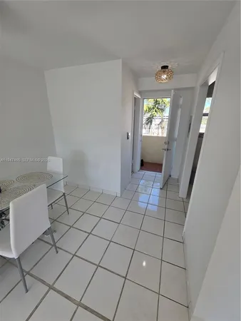 a bedroom with a bed and a lamp on table