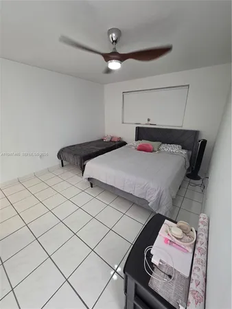 a bathroom with a sink toilet and mirror