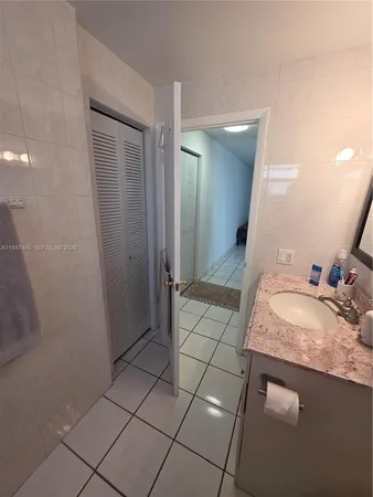 a view of roof deck with furniture and a fire pit