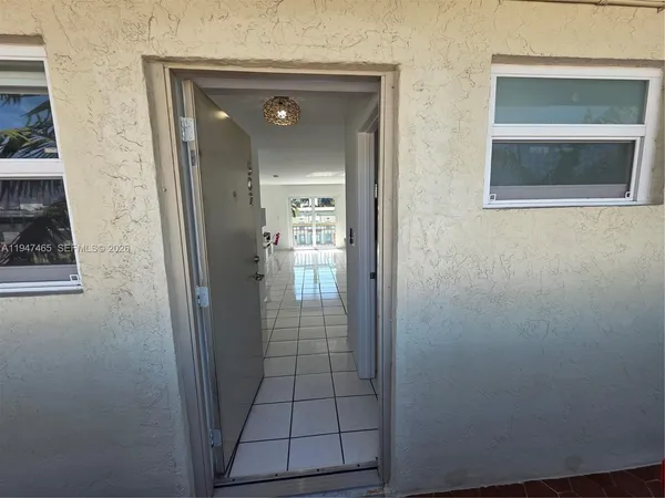 a kitchen with a sink a stove and a refrigerator