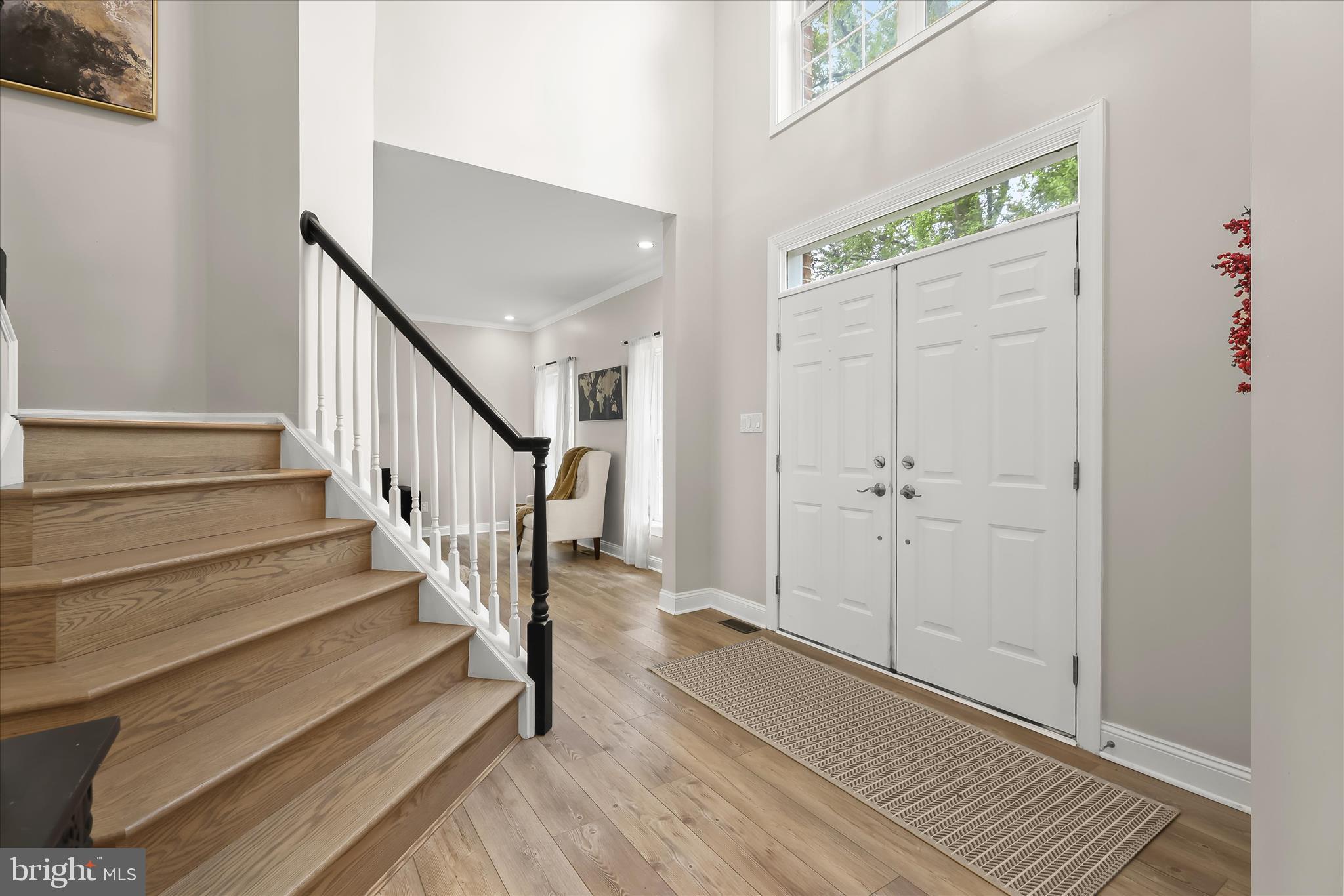 515 Garrison Forest Road Owings Mills, MD 21117 - Photo 3 of 84 a view of a hallway with wooden floor and staircase