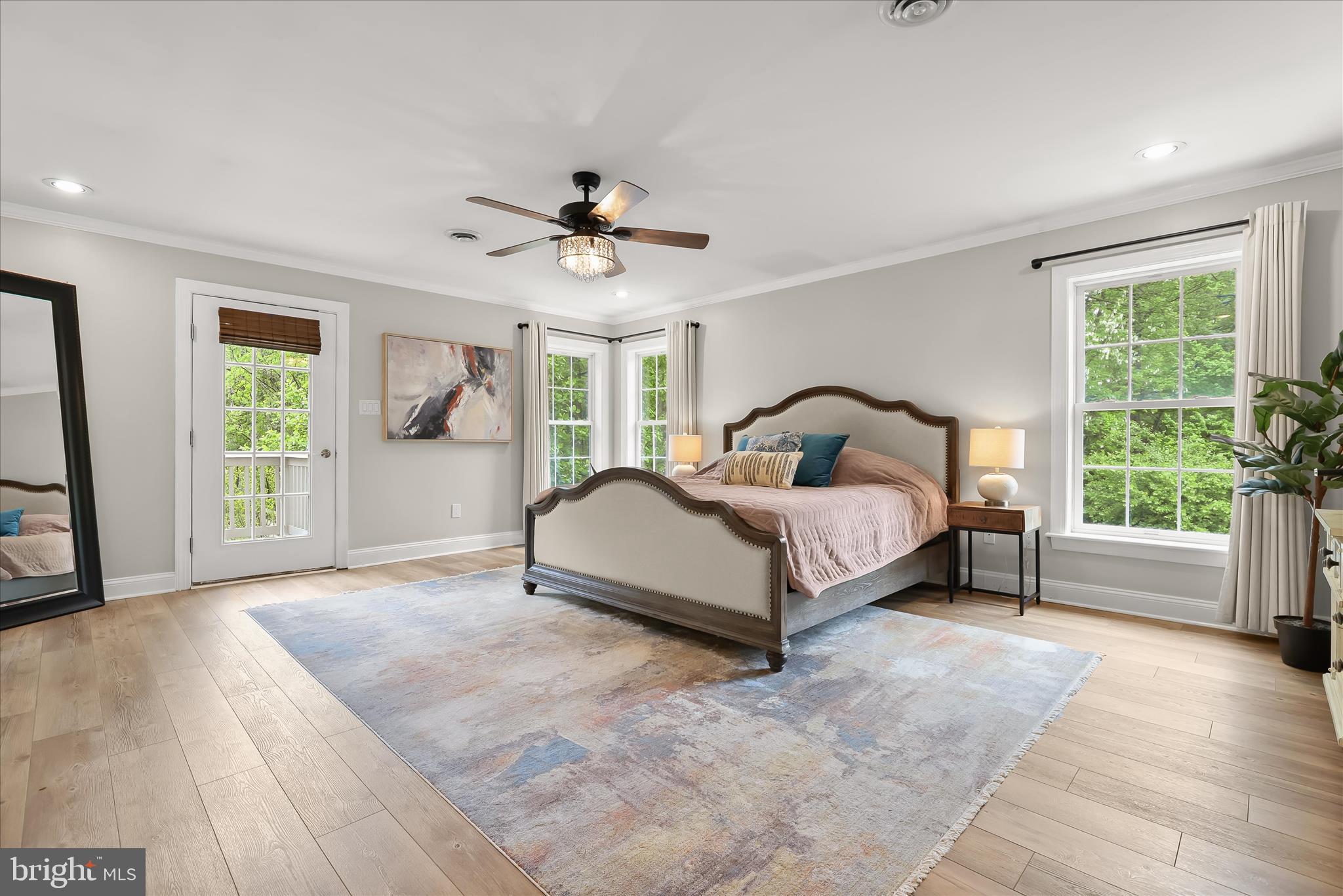 515 Garrison Forest Road Owings Mills, MD 21117 - Photo 36 of 84 a spacious bedroom with a bed a window and potted plant on the dresser