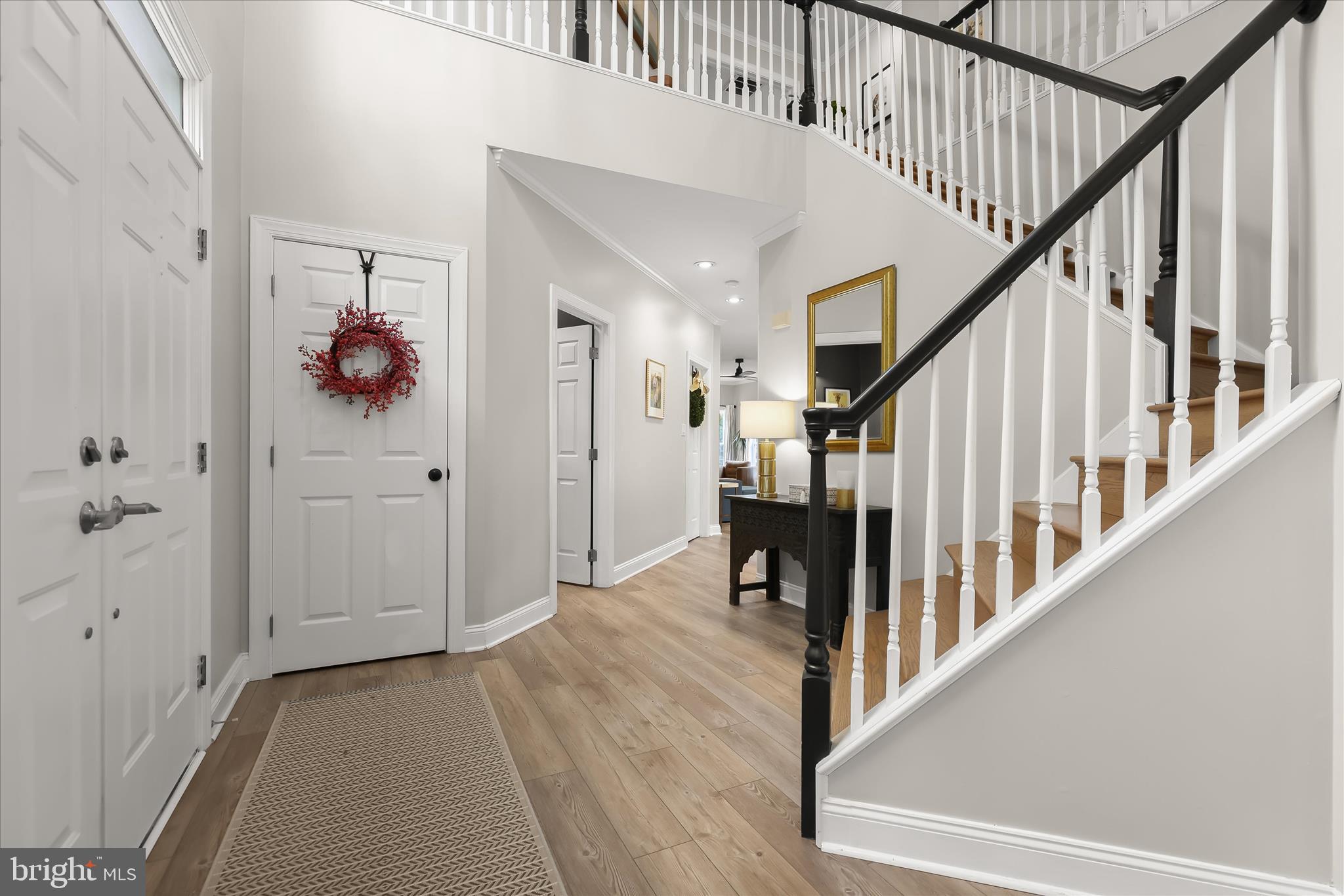 515 Garrison Forest Road Owings Mills, MD 21117 - Photo 4 of 84 a view of hallway with stairs and wooden floor