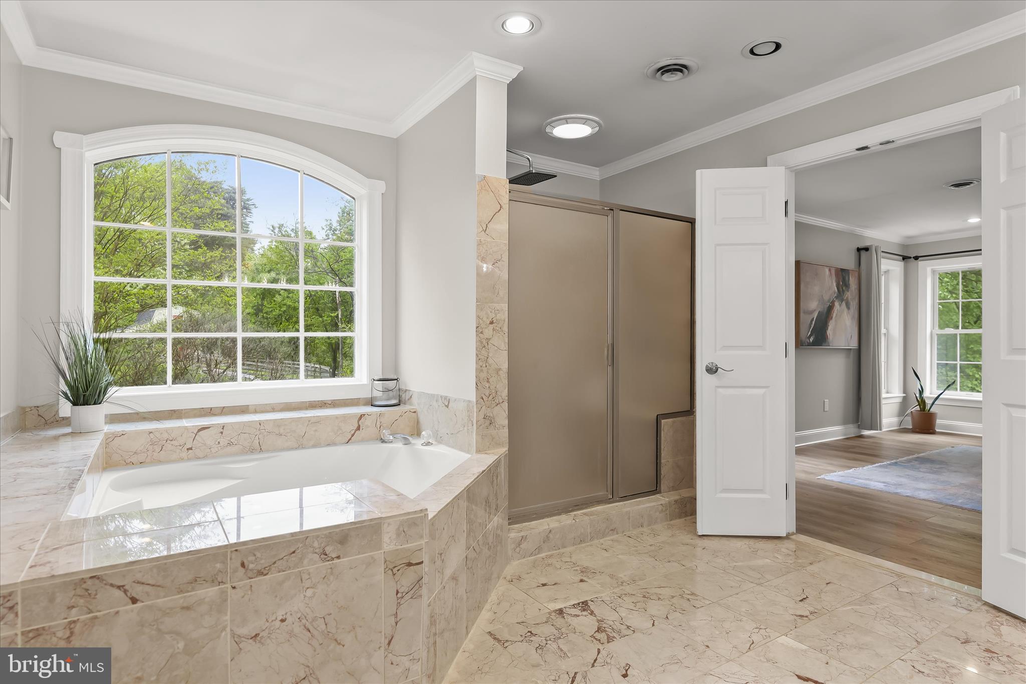 515 Garrison Forest Road Owings Mills, MD 21117 - Photo 43 of 84 a spacious bathroom with a tub shower and sink
