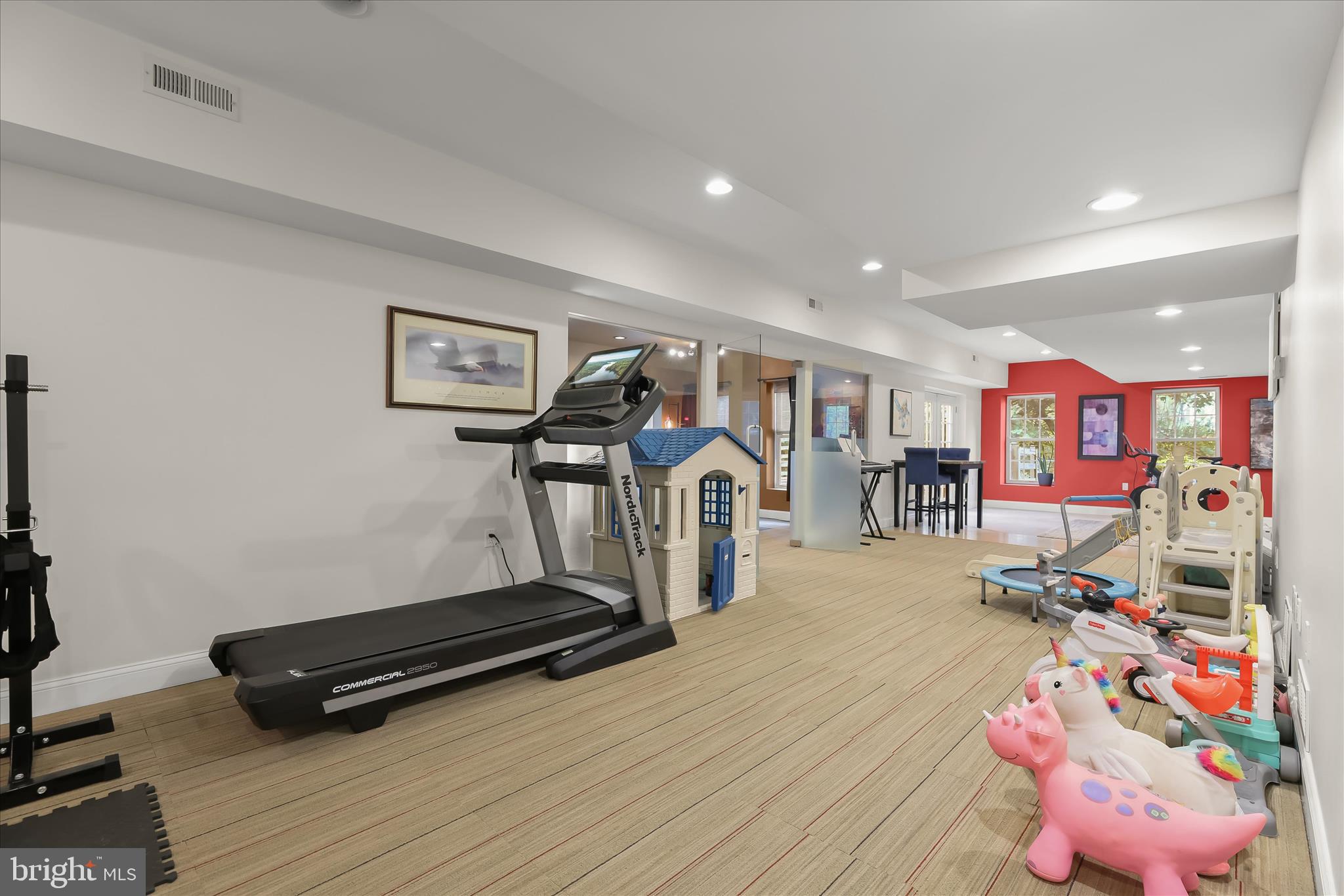 515 Garrison Forest Road Owings Mills, MD 21117 - Photo 64 of 84 a room with gym equipment and a flat screen tv