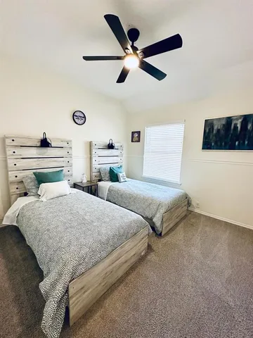 a bedroom with a bed and cabinet