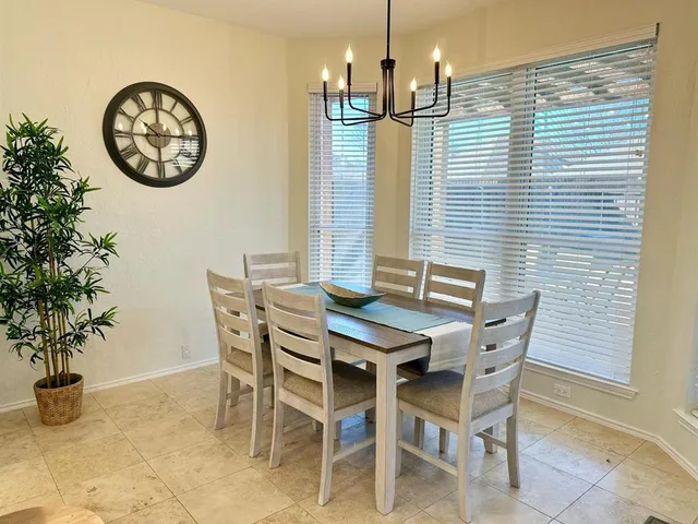 a view of a dining room with furniture