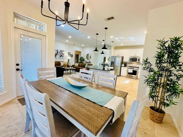a view of a dining room with furniture