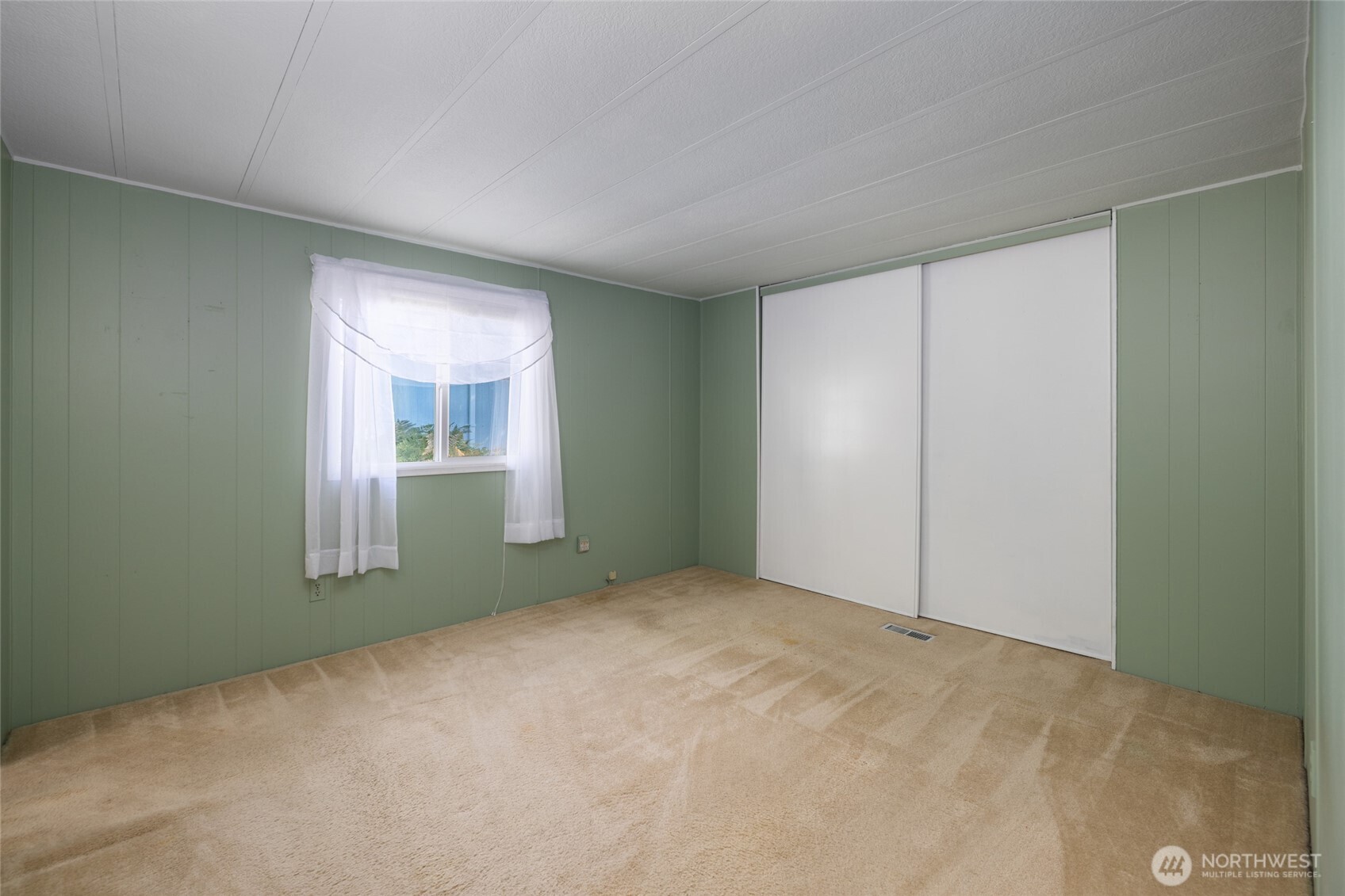 3333 228th Street Southeast, Unit 100 Bothell, WA 98021 - Photo 18 of 27 a view of an empty room with window