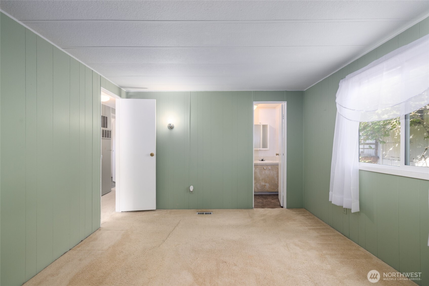 3333 228th Street Southeast, Unit 100 Bothell, WA 98021 - Photo 19 of 27 an empty room with windows and closet