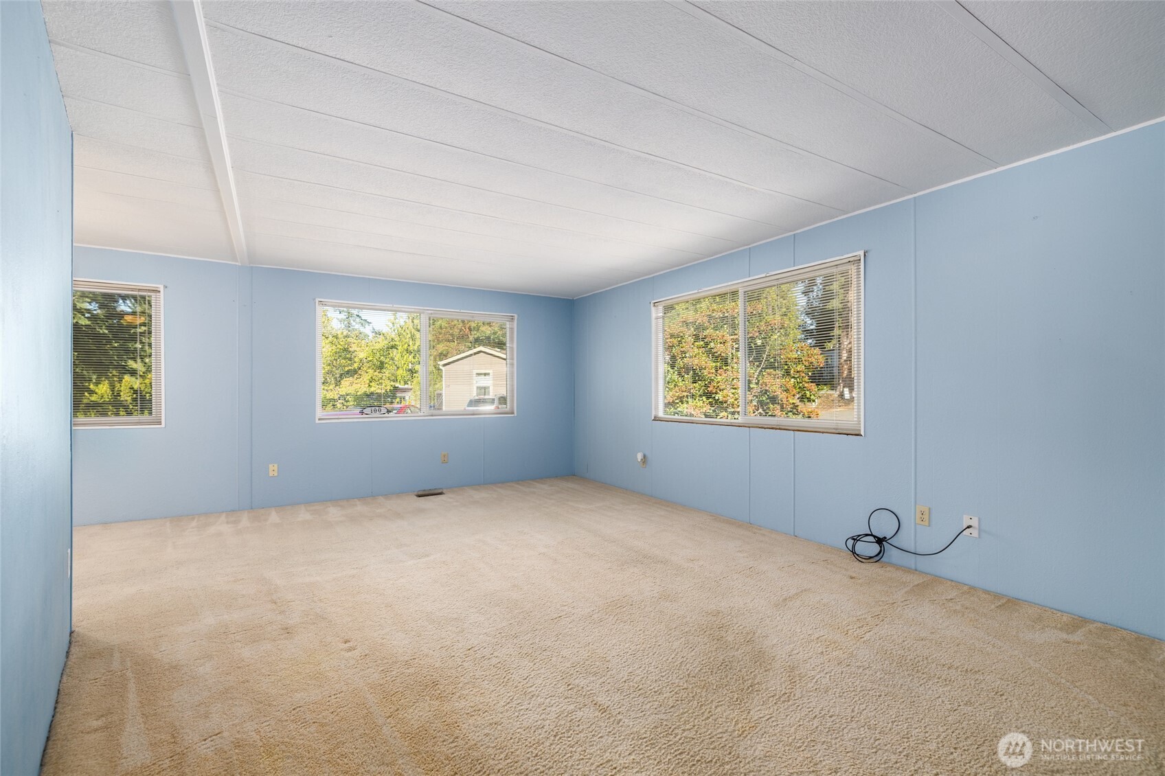 3333 228th Street Southeast, Unit 100 Bothell, WA 98021 - Photo 6 of 27 an empty room with windows