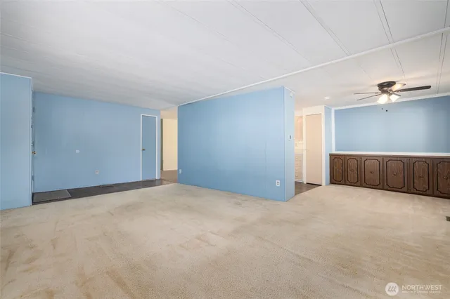 a view of an empty room with a cabinet