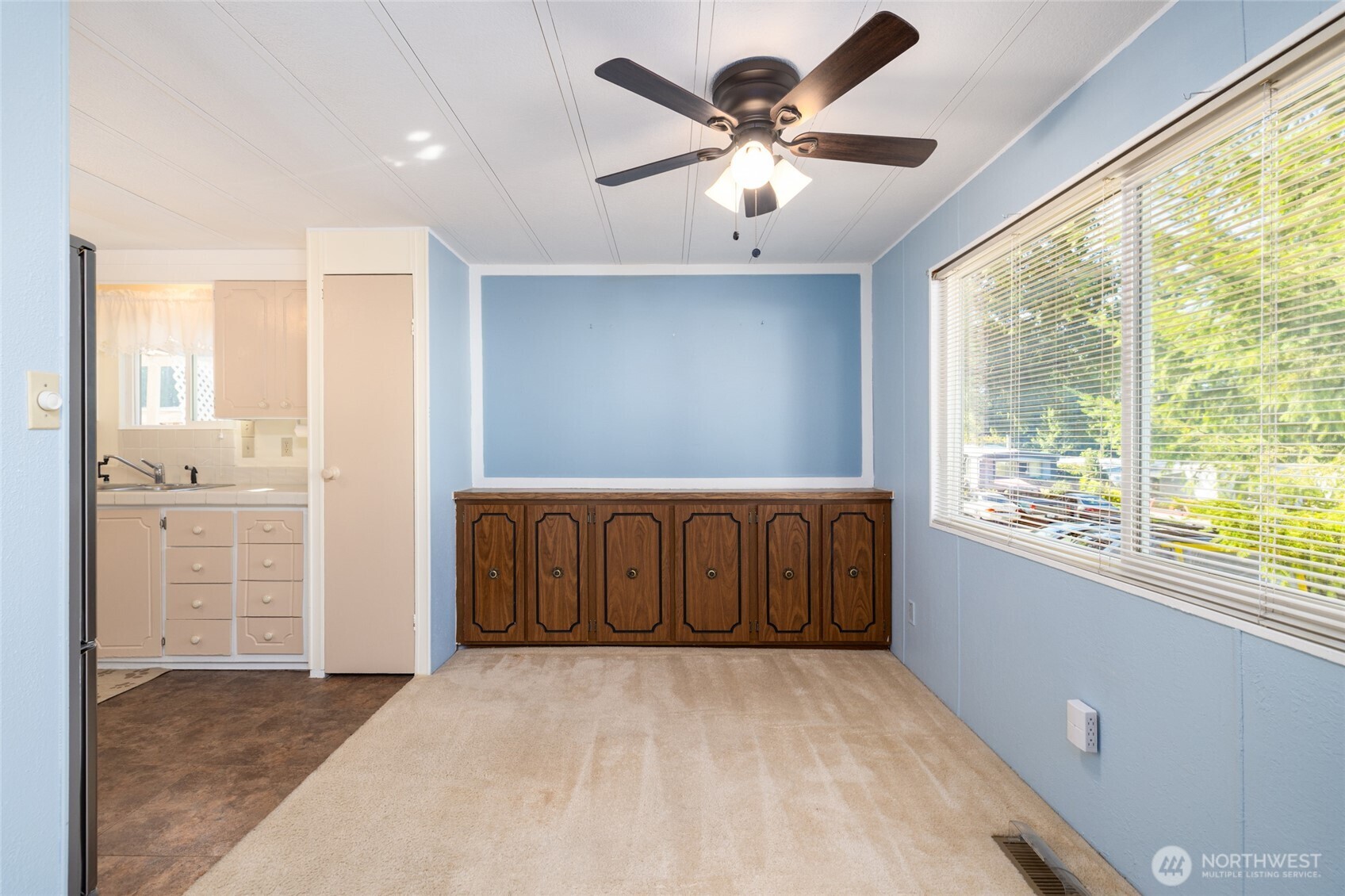 3333 228th Street Southeast, Unit 100 Bothell, WA 98021 - Photo 9 of 27 an empty room with windows and cabinet
