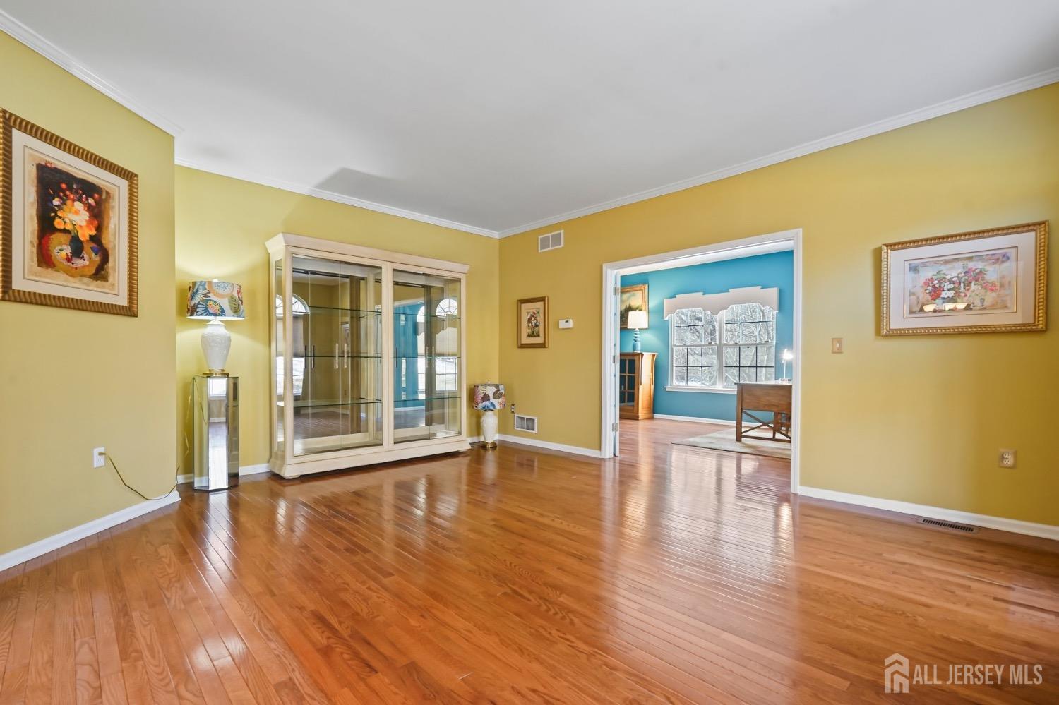 15 Rues Road Cream Ridge, NJ 08514 - Photo 8 of 49 a view of an empty room with wooden floor and a window