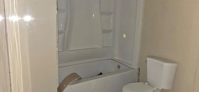 a view of hallway with closet