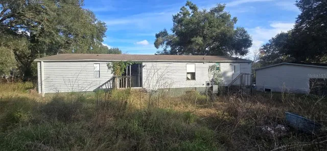 a backyard of a house with lots of green space