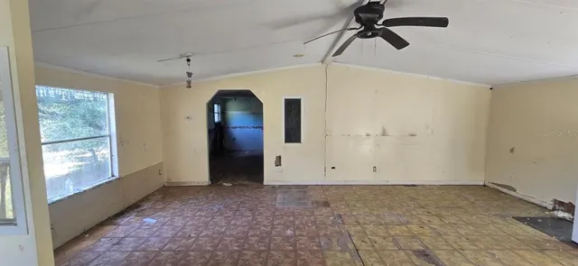 a view of empty room with windows