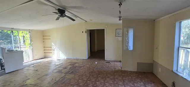 a view of an empty room with a window