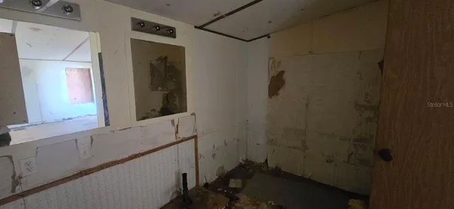 a bathroom with a sink and shower