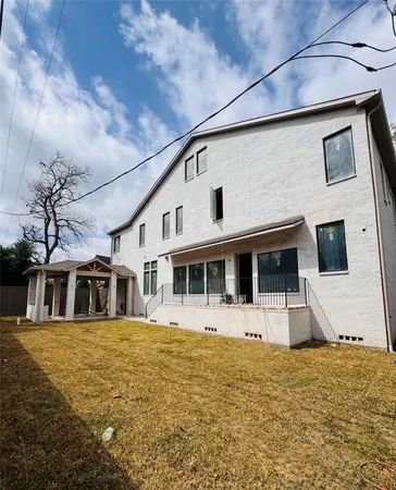 a front view of a house with large windows